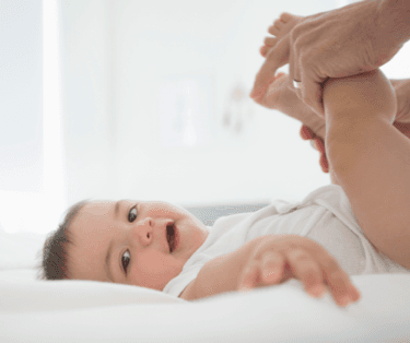 Happy baby getting a diaper changed