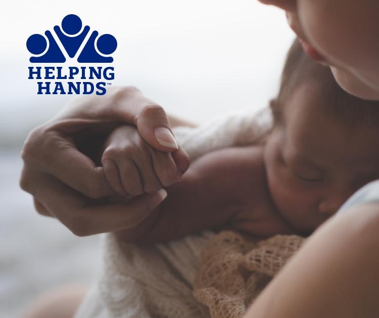 Mom holding baby's hand