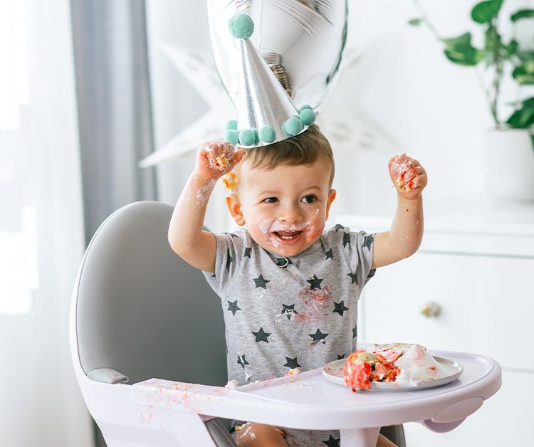 Mother preparing a cake with his baby