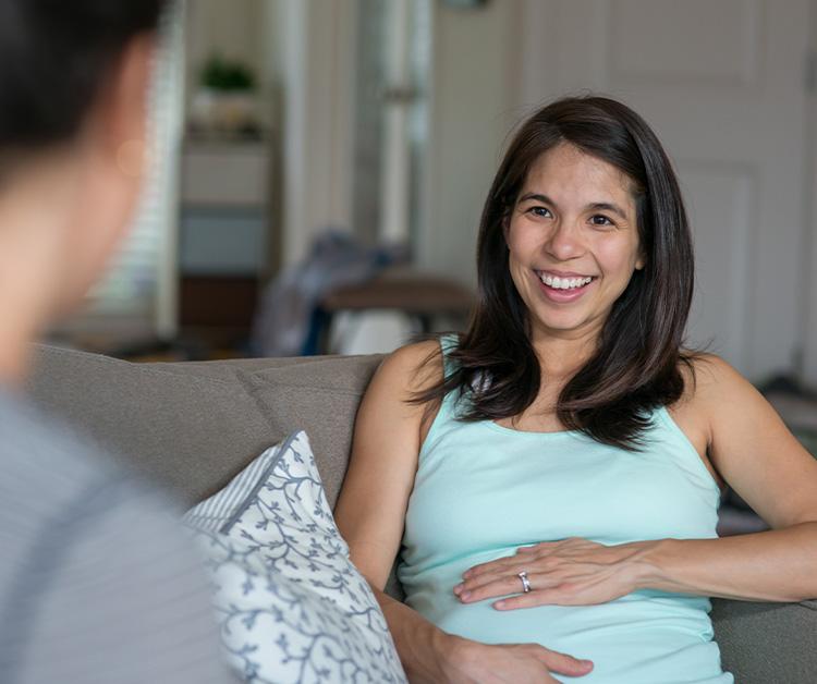 Expecting mom and friend looking at sonogram